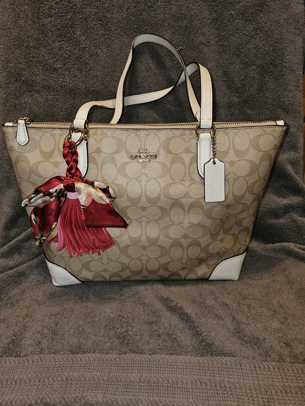 Coach Beige Signature Canvas Tote with White Trim and Red Tassel Accent